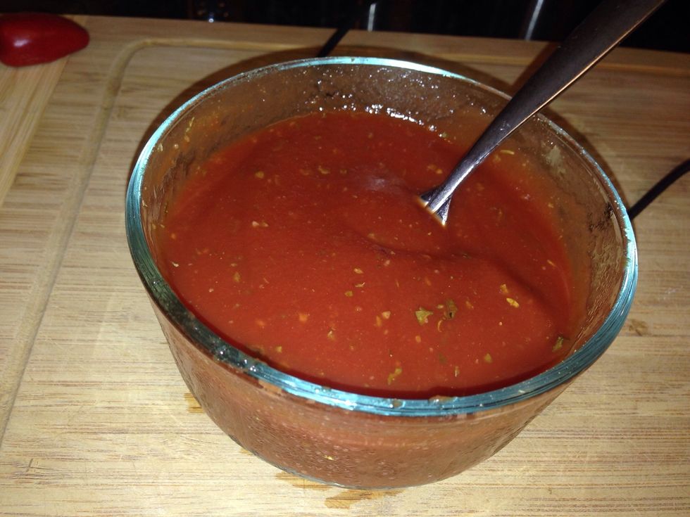 Coat the bottom of a casserole dish with 1/3 cup of the seasoned tomato sauce.