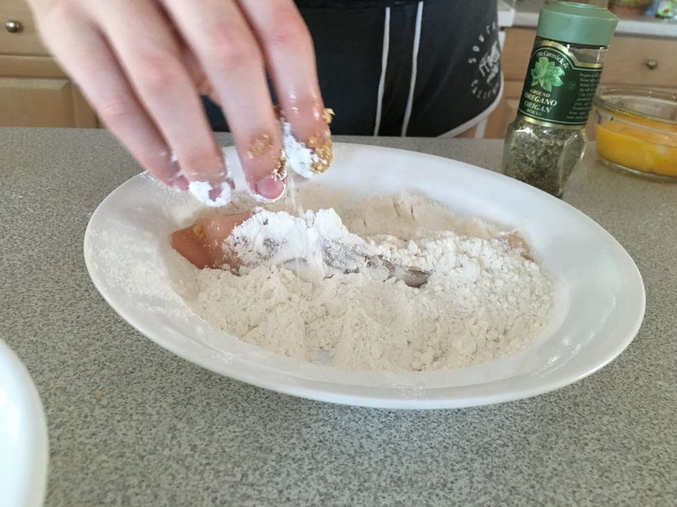 Coat the chicken breast with flour.  This keeps the chicken moist while it's cooking.