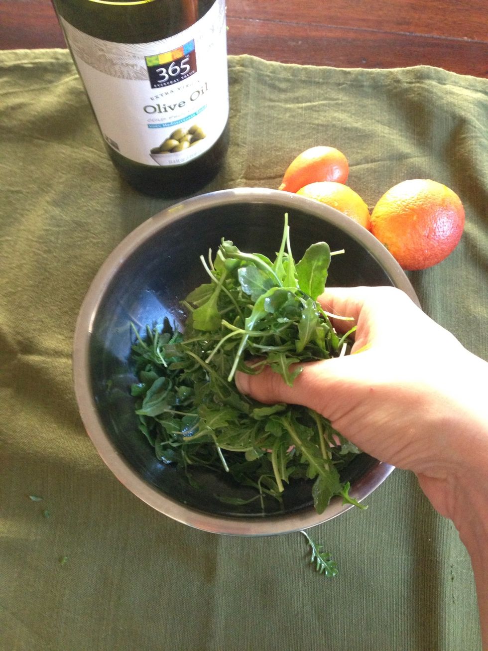 Coat the greens with olive oil. If available, use a citrus flavored olive oil. Add salt and pepper. I just used my hands to coat.