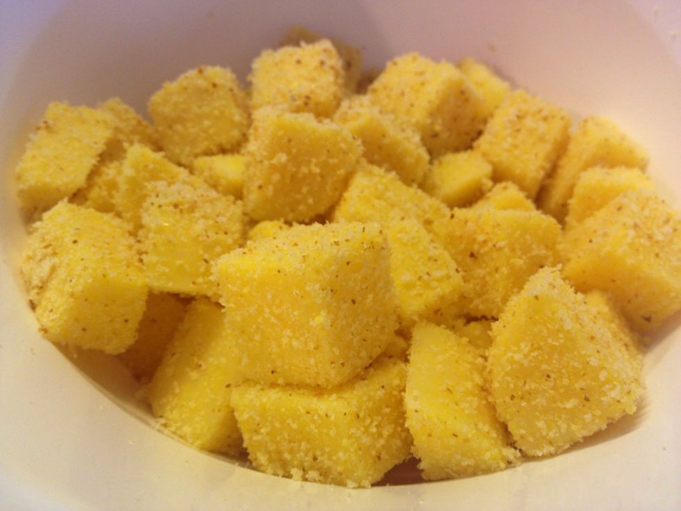 Coat the polenta with the cornmeal and shake off the excess!