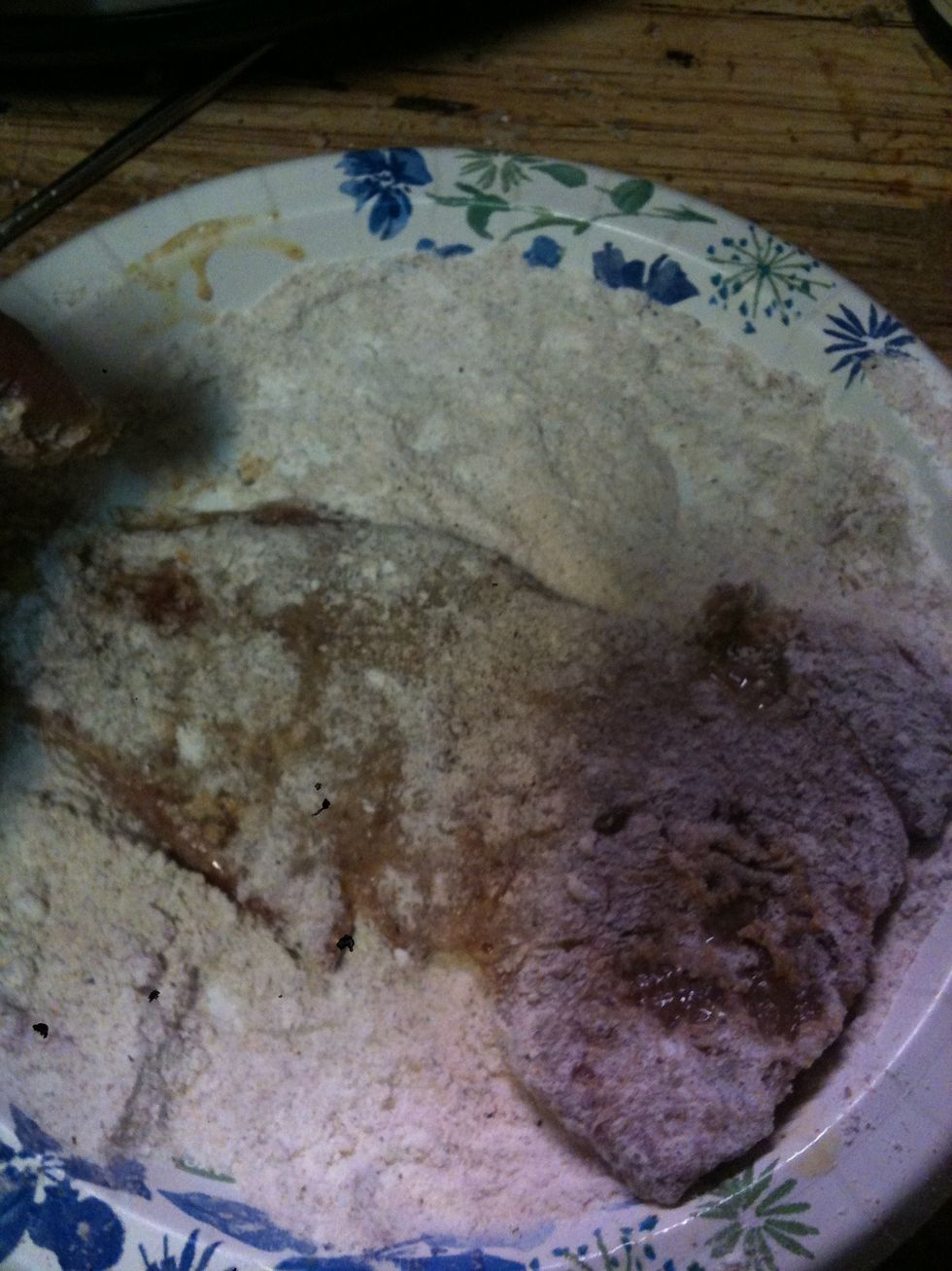 Coat the steak in the flour mixture one last time.