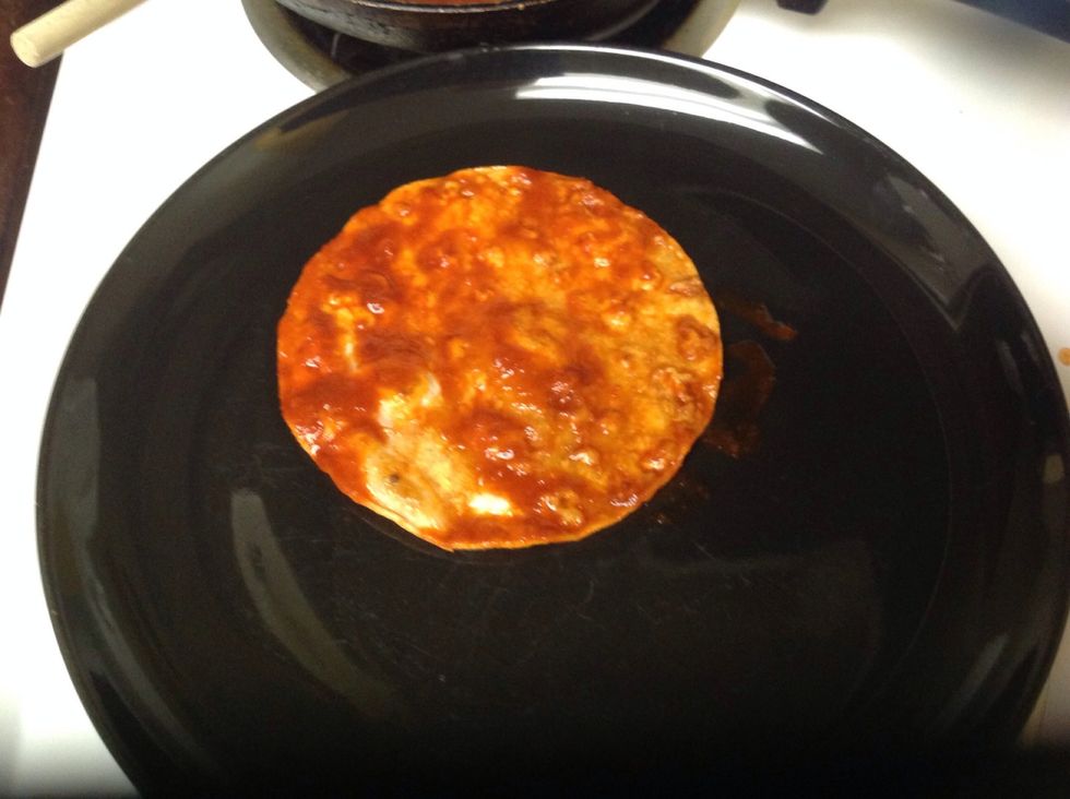 Coat tortillas with sauce