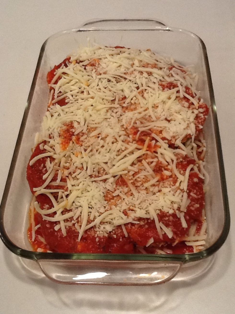 Coat with rest of sauce and cheese.