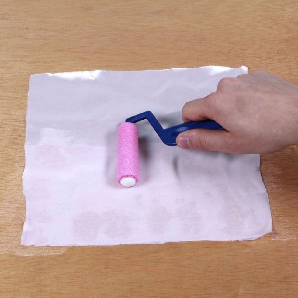 Coat your material evenly with Inkodye. It can be hard to see since Inkodye comes out of the bottle colorless, but you don't need to soak the material. A thin, even coat will do.