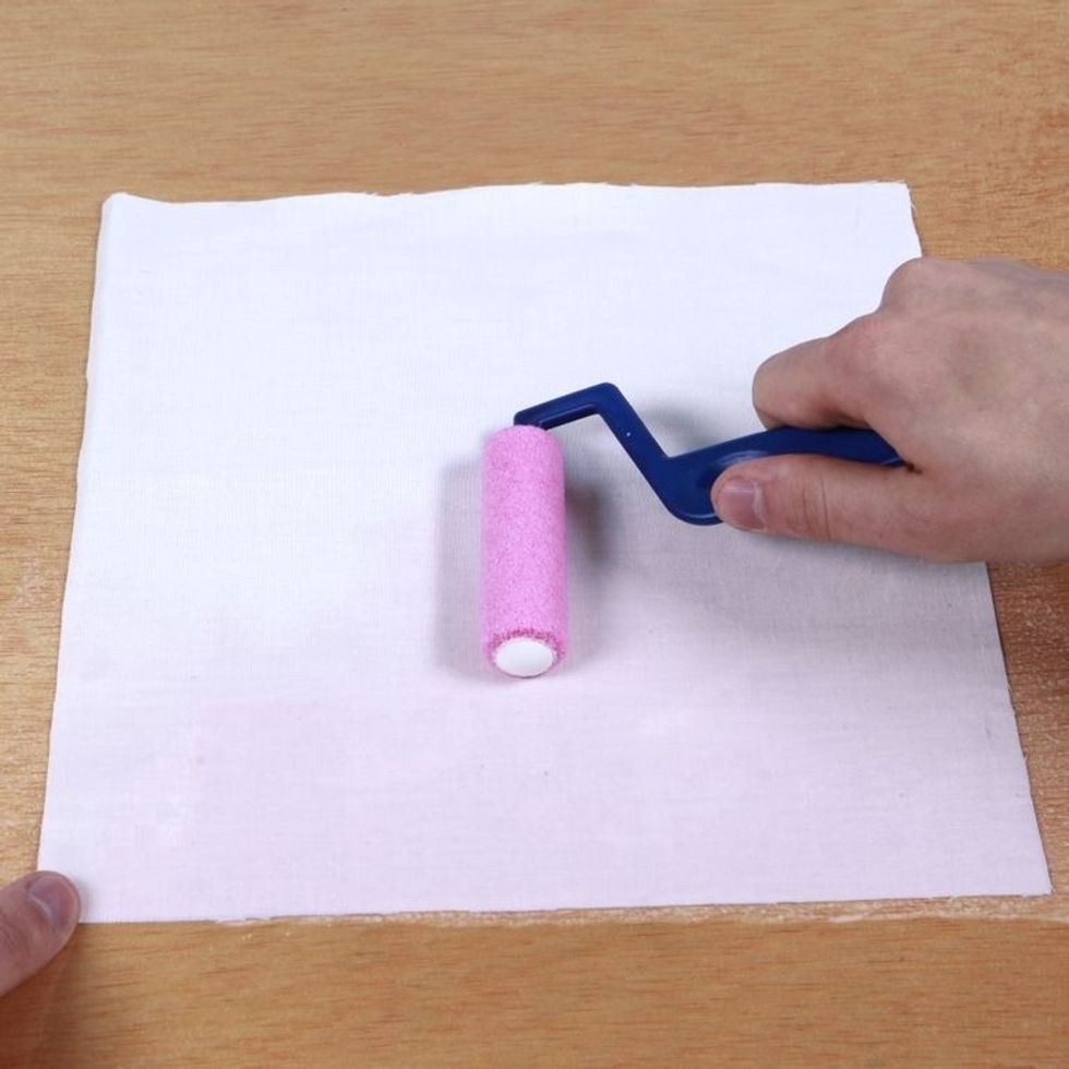 Coat your material evenly with Inkodye. It can be hard to see since Inkodye comes out of the bottle nearly colorless, but you don't need to soak the material. A thin, even coat will do.