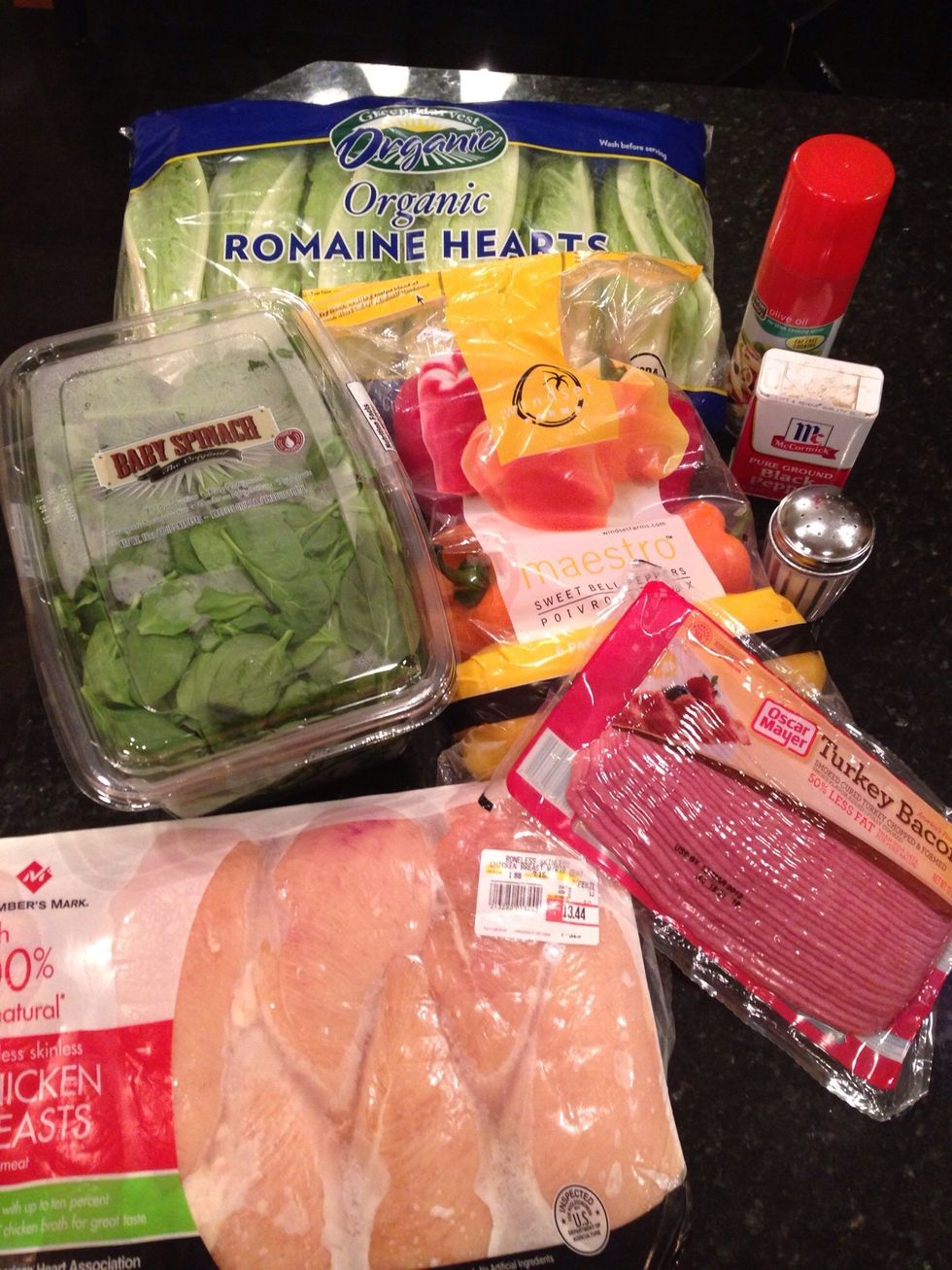 Cobb salad ingredients- Spinach leaves, romaine lettuce, chicken breast, turkey bacon, sweet bell peppers, mushrooms, cucumbers, olive oil spray, salt, pepper