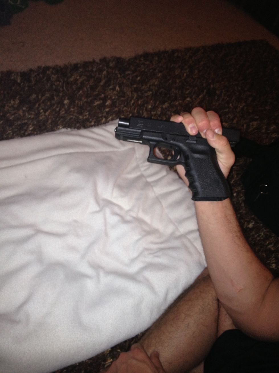 Cock back the slide with one hand