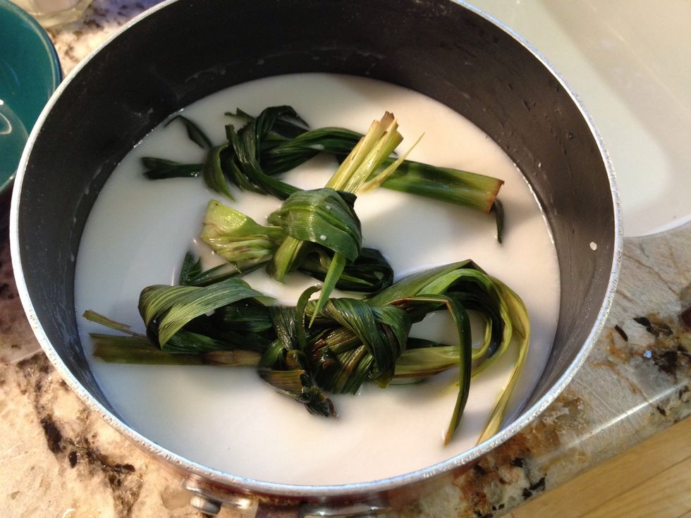 Coconut milk with some water to cook the rice.