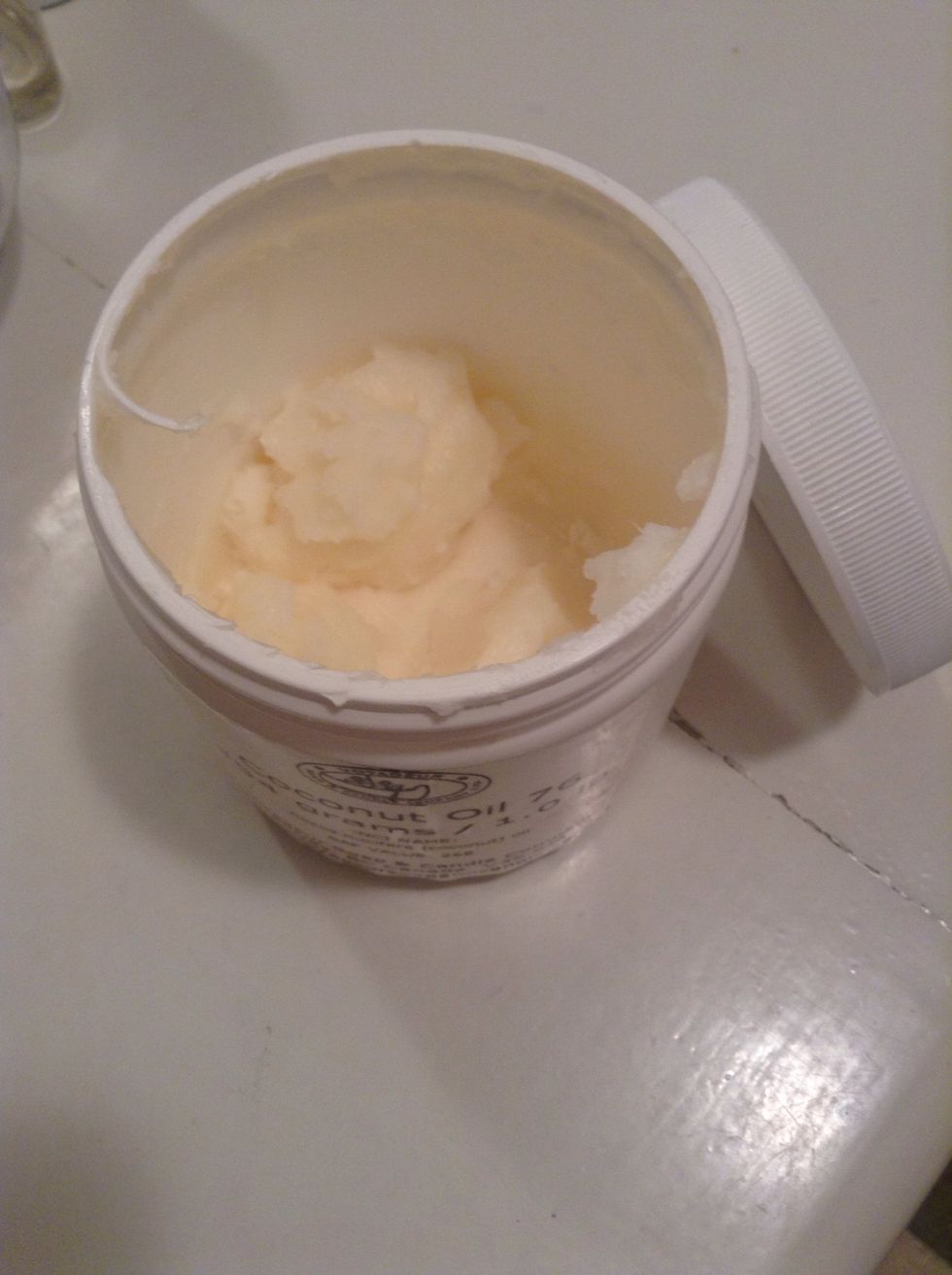 Coconut oil would be a good replacement for up to 10% of the butter amount as it has a very low melting point. For this same reason, you can't use it as all the oil or all the butter.
