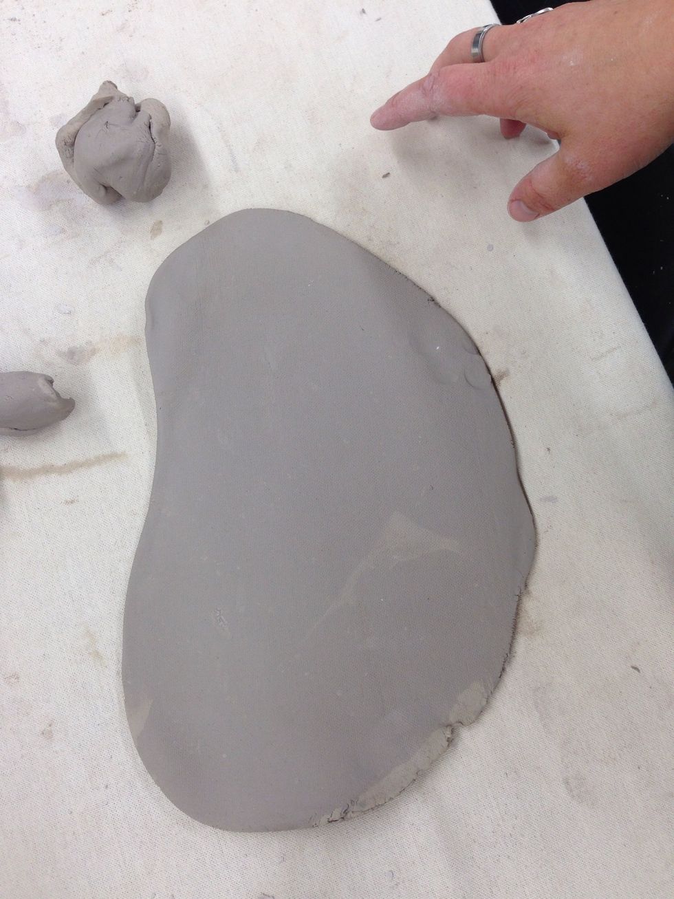 Coil Pots:  Roll a slab of clay for the base of your coil pot.