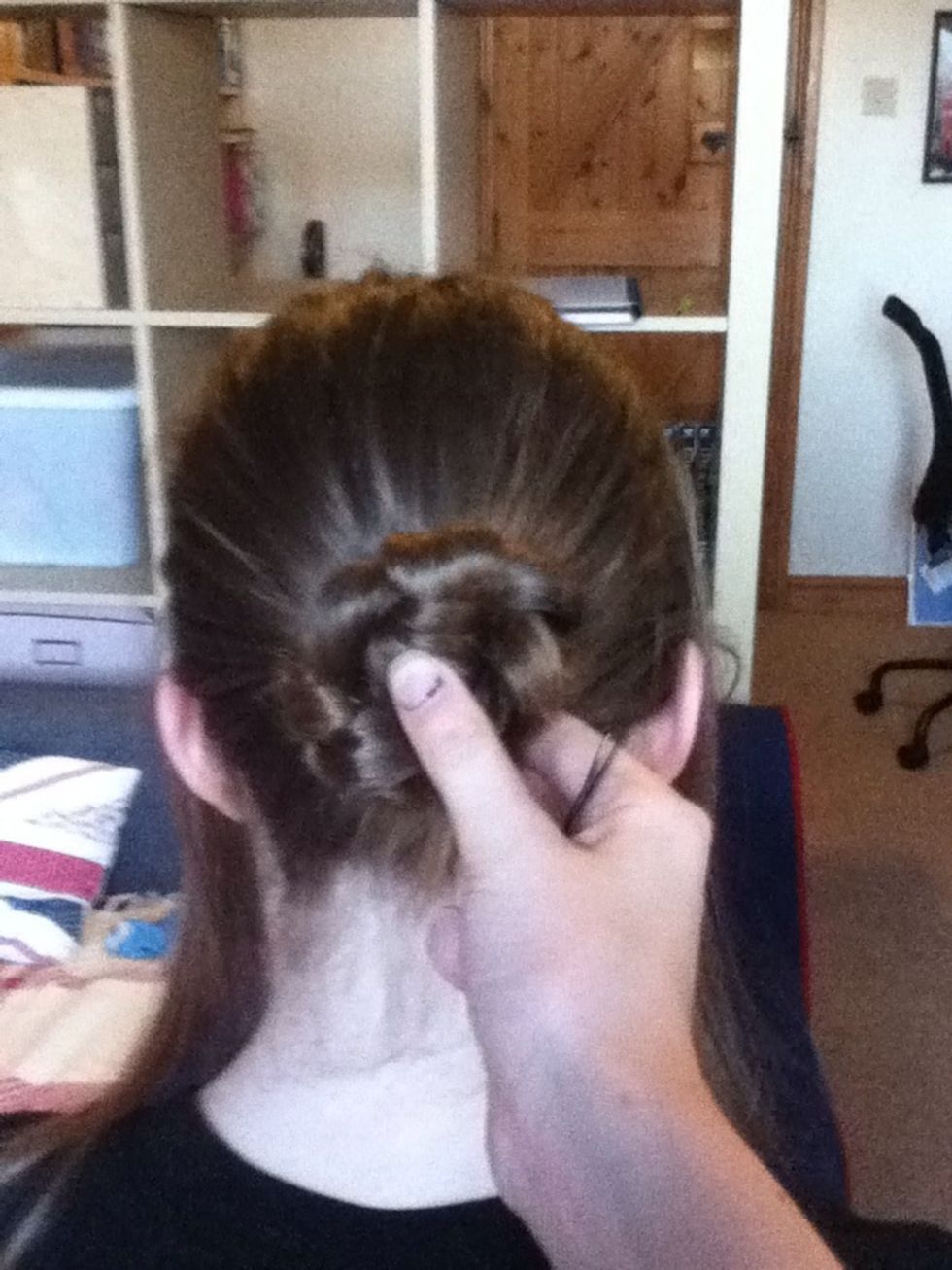 Coil the braid around to form a bun. Secure with bobby pins.