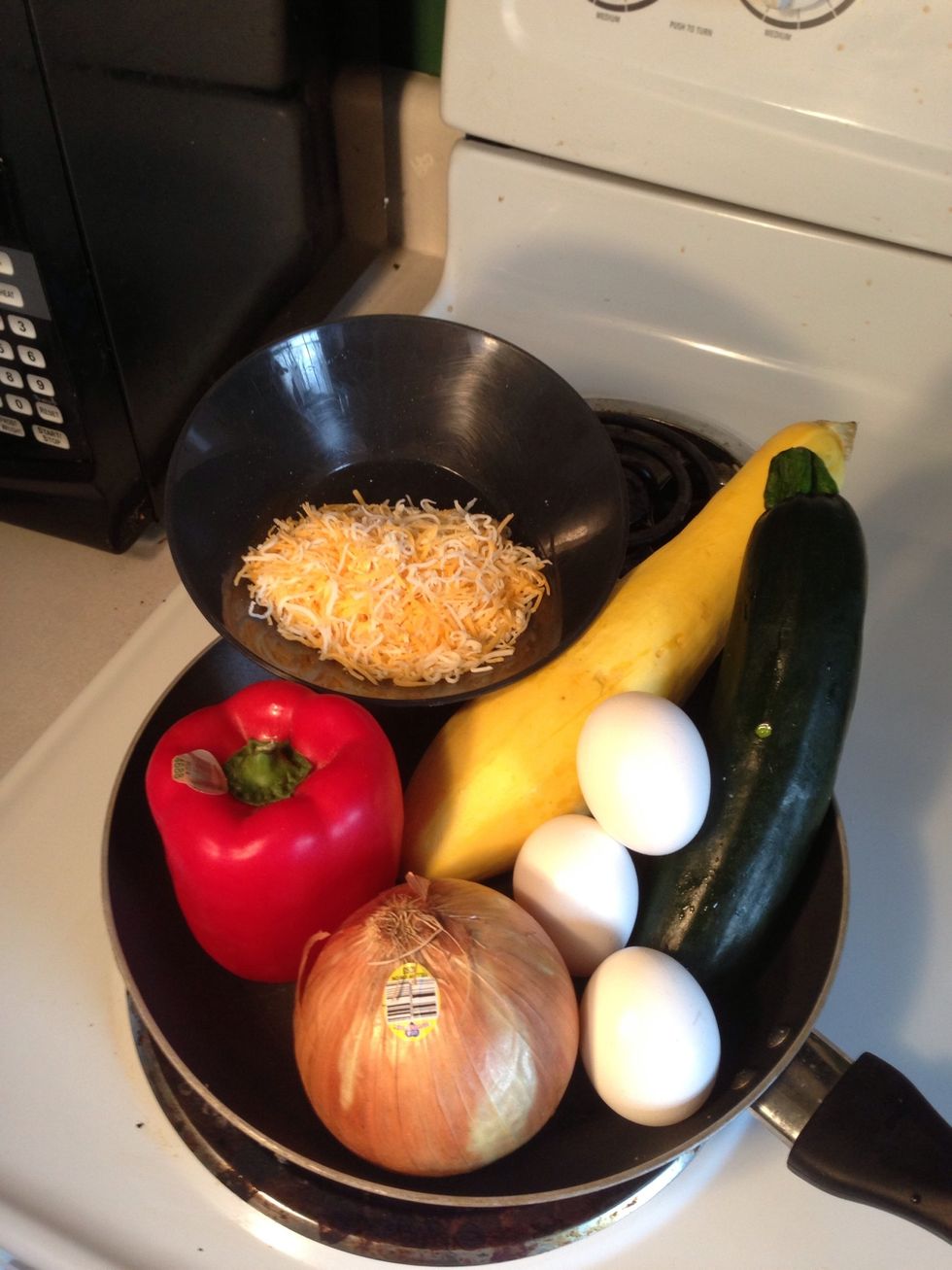 Collect all of your ingredients: eggs, vegetables, cheese, oil, salt and pepper
