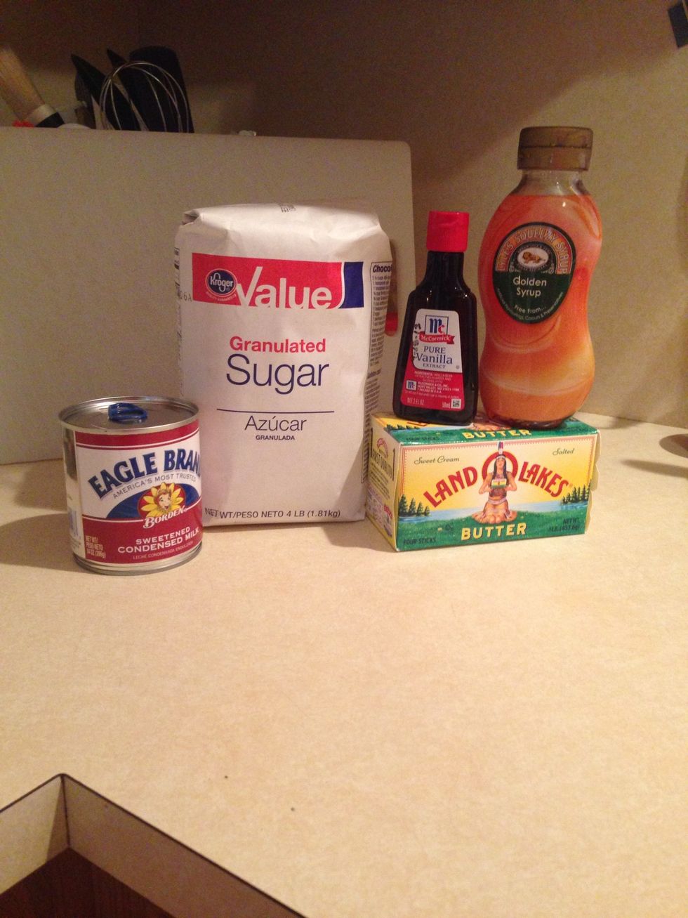 Collect all of your ingredients: I can of condensed milk, 4lbs sugar, 2 tsp. vanilla, 4oz butter, 2 cups milk, 2 tbsp. dessert spoon syrup