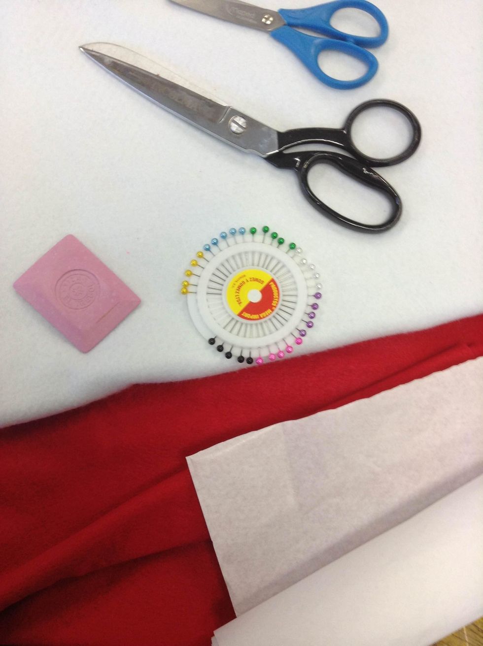 Collect all the materials: Felt, thread, needles, pins, sewing machine, chalk, undoer, pencil, manifold paper, paper scissors, fabric scissors, filling.