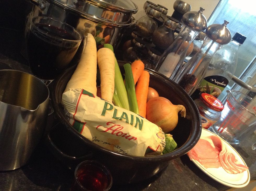 Collect all your ingredients together and grab yourself a roasting tray. We're pretty much making roast vegetables for the first step. This will be our vegetable trivet.