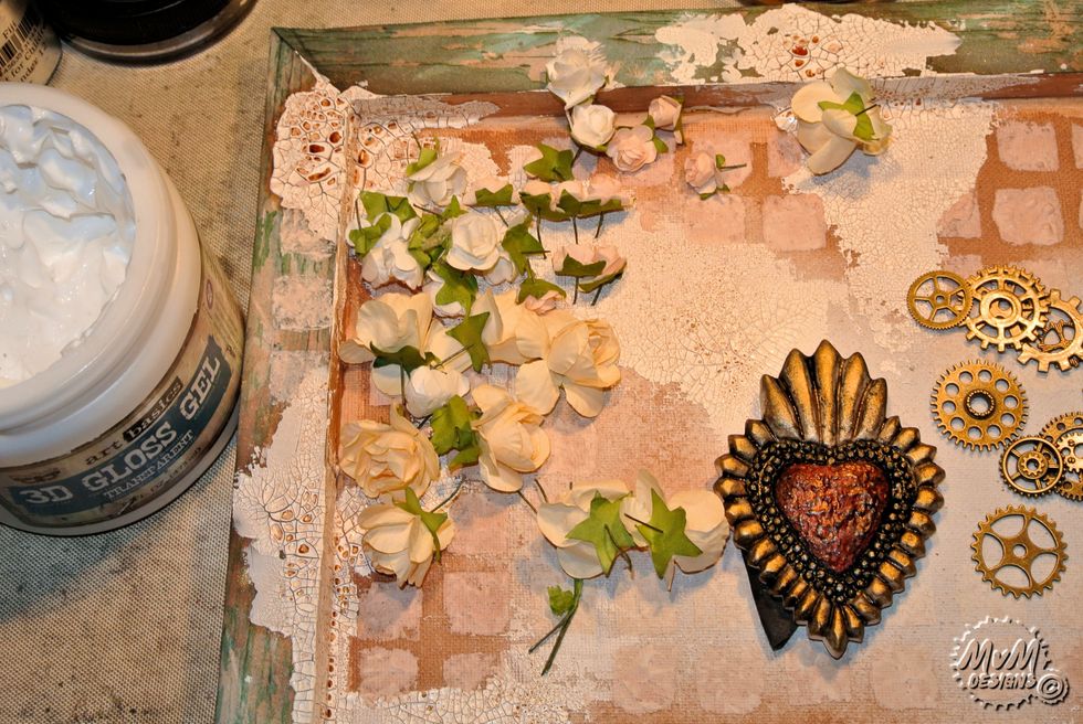 Collect some paper flowers and other embellishments.