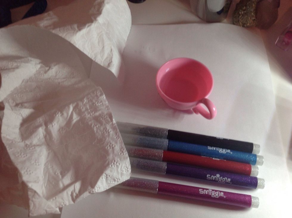 Collect some water,paper,tissue and pens. Any pens will do. Works best with white paper.Remember you can draw what ever you like,I'm drawing some holiday bunting.