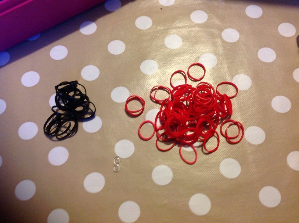 Collect your bands, mine are in red because I am making an exploding creeper, but you could use light green or dark green or any other colours. Also get a C clip or S clip.