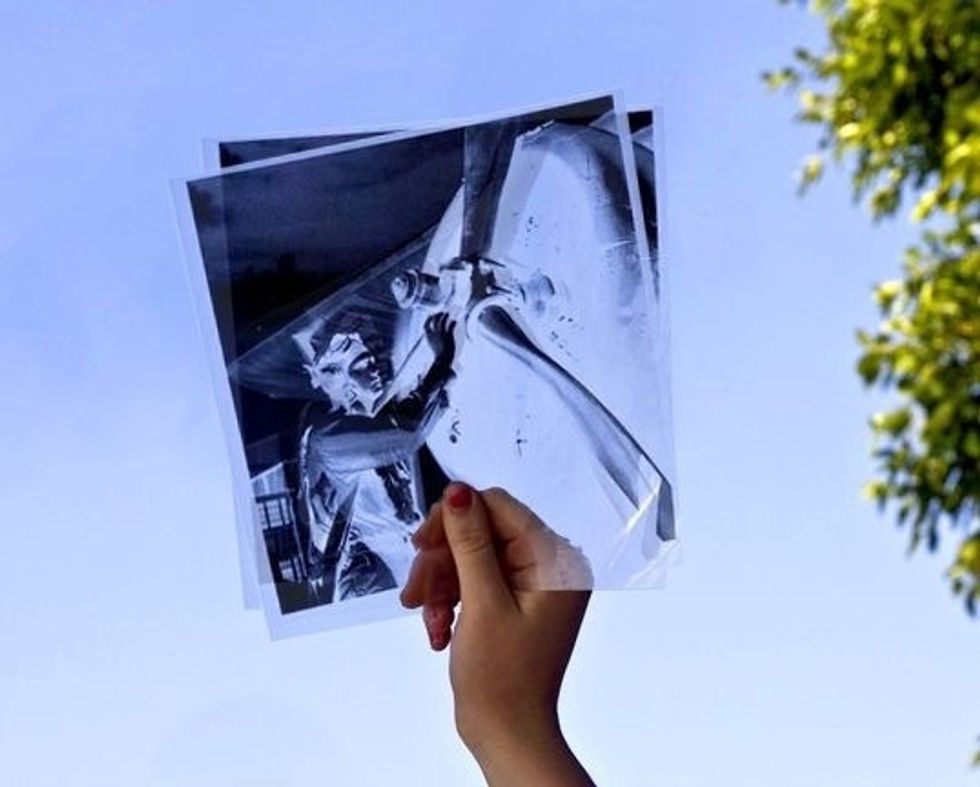 Collect your prints and take them outside. To turn your two transparencies into one negative, hold them up to the sky (or a window) for the best visibility...