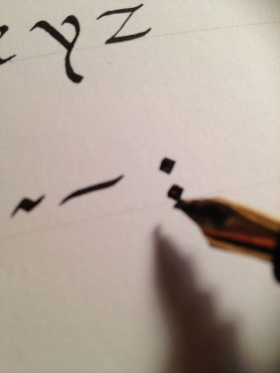 Colons should be formed with plain dots, to avoid them looking cluttered or being confused with semicolons.