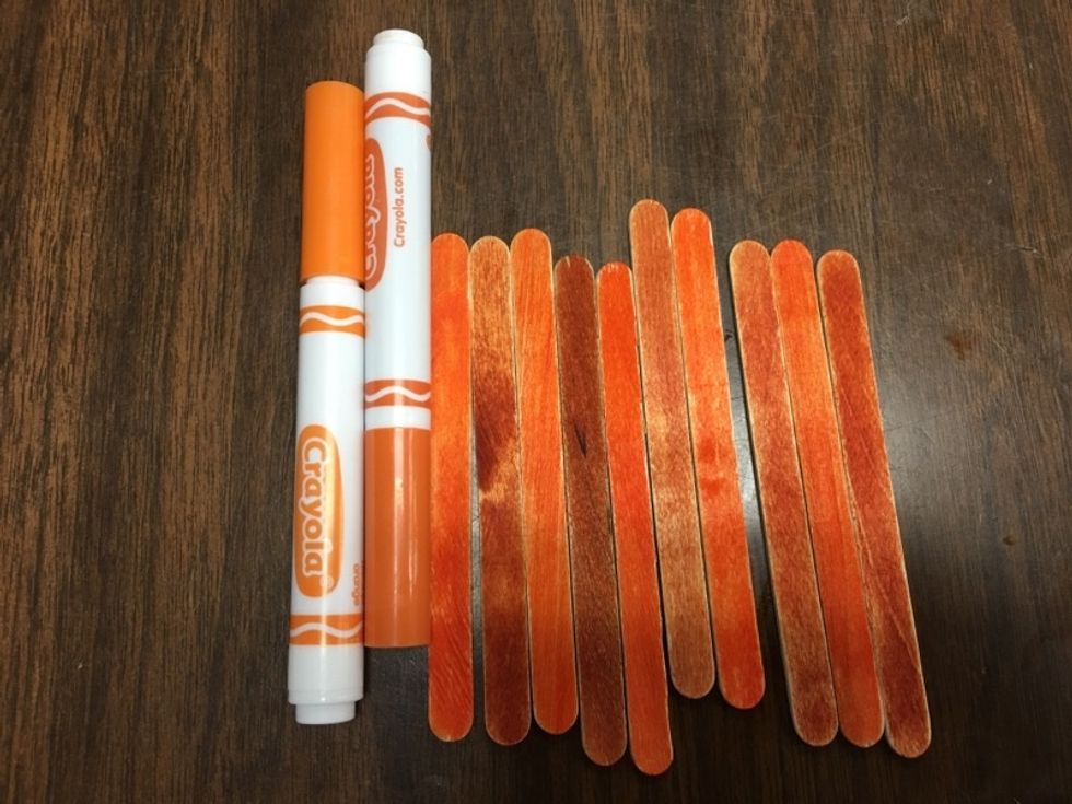 Color all popsicle sticks orange.