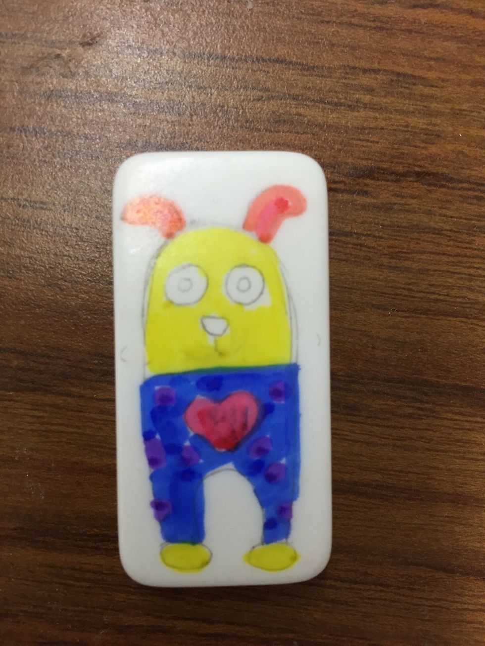 Color in design with permanent markers.