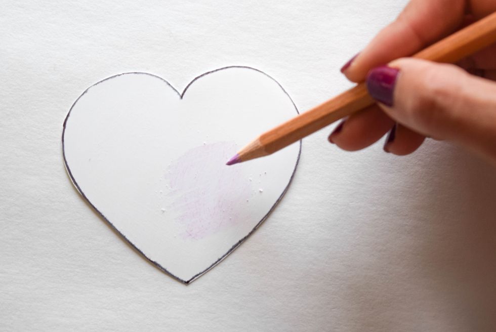Color in your heart with colored pencils. Keep in mind that the colors will become darker once your piece has shrunk.