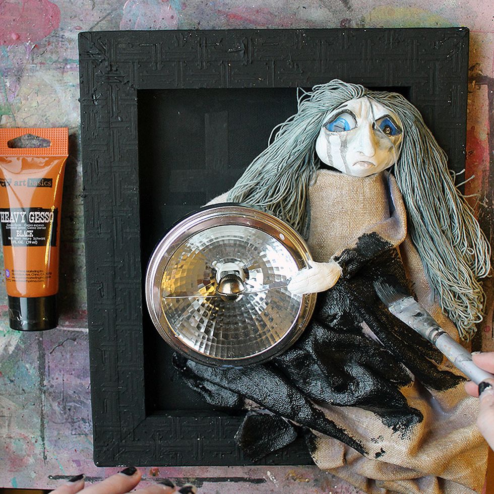 Color the fabric with black gesso and/or Art Alchemy paints.