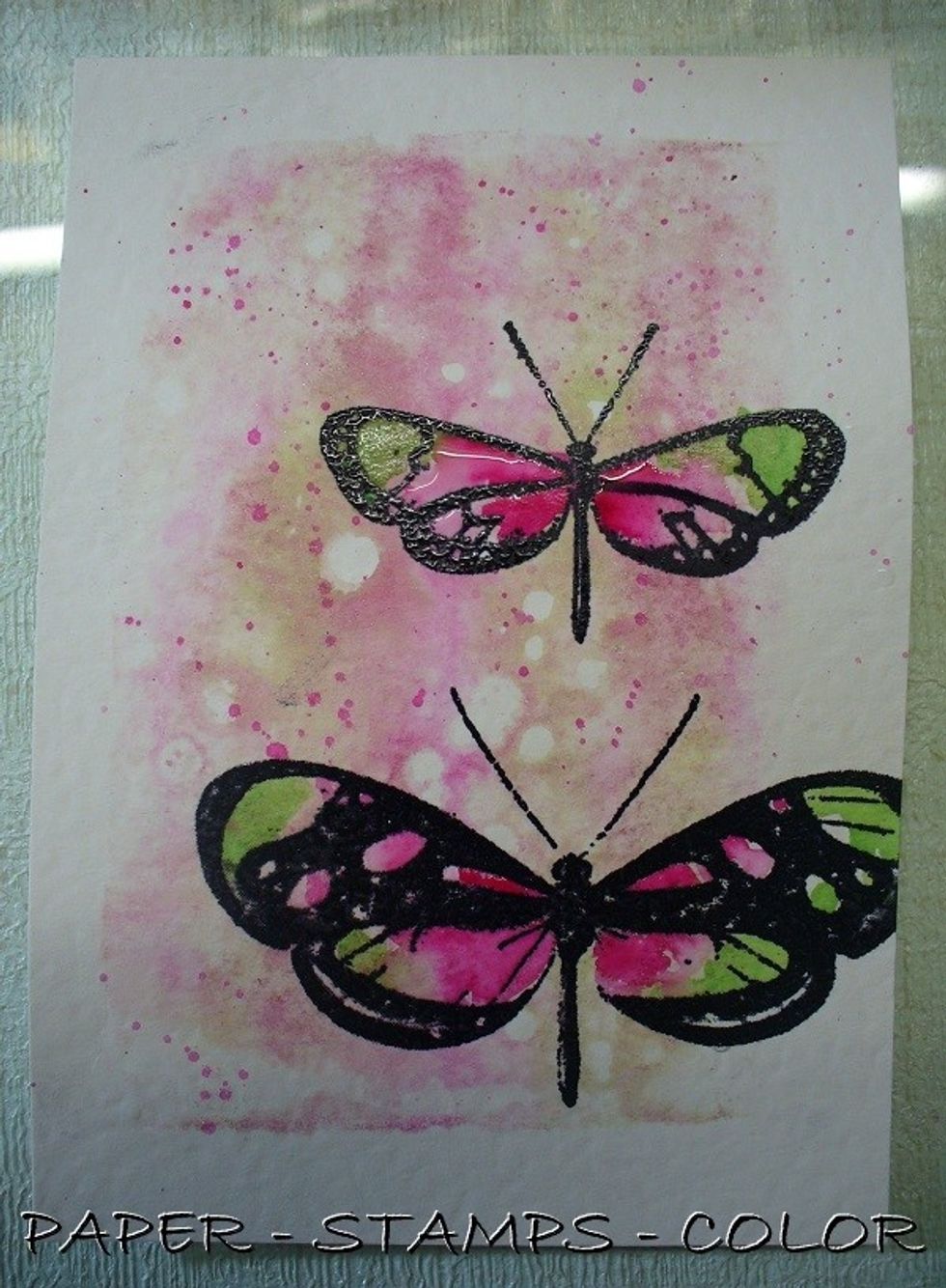 Color the images with the Minx colors. Use some of the ink to splatter over the background as shown.
