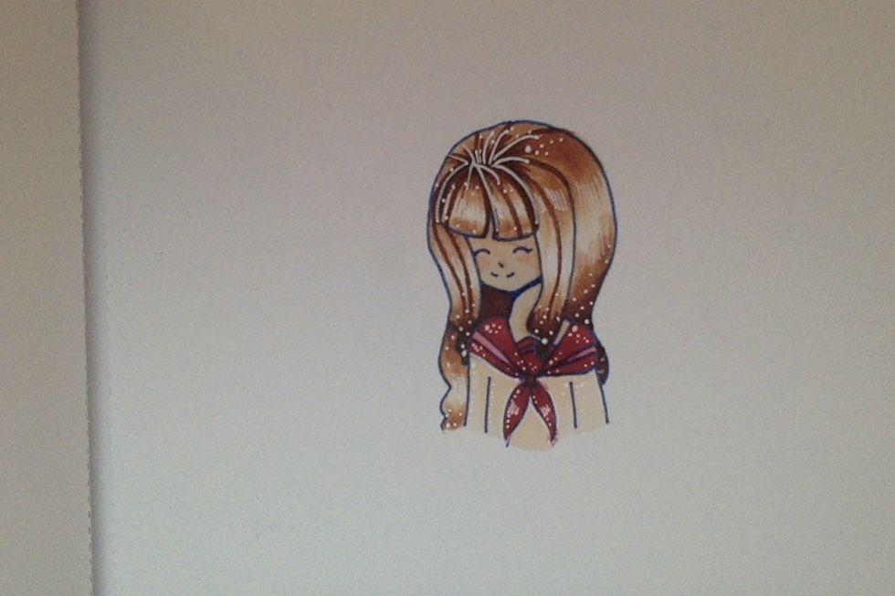 Color the rest of the face with a lighter color. (used E00 and E000 copic ciao marker for face)