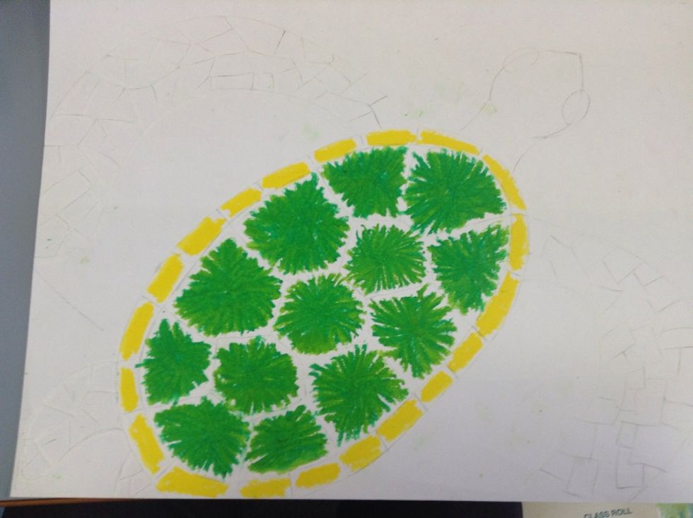 Colour in the rectangle shapes on the edge of the shell with your yellow pastel.