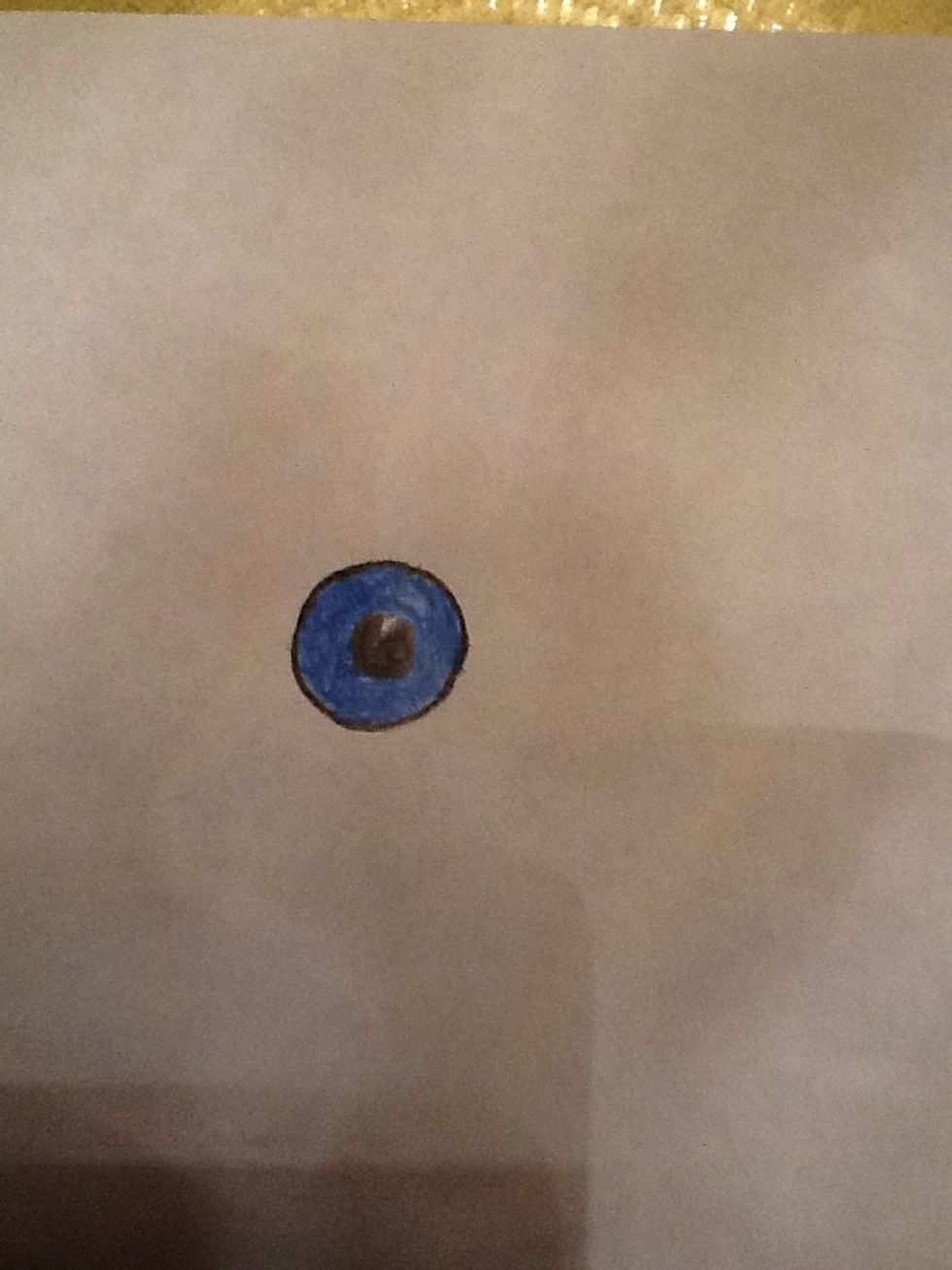 Colour the white circle in black and colour around the line you drew.