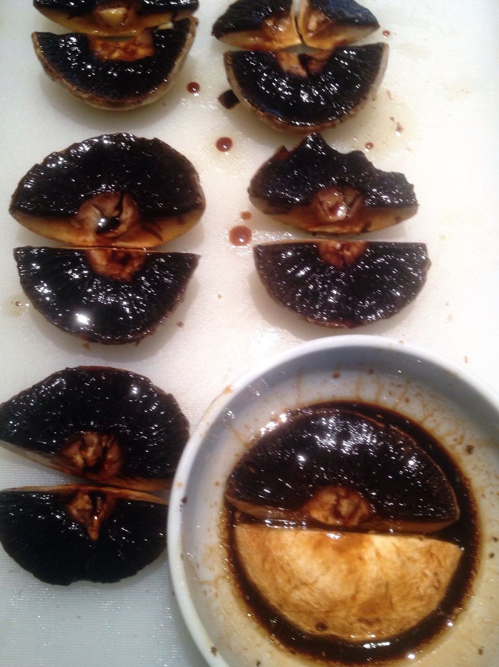 Combine 1/4 cup of olive oil with all the tamari in a small bowl and lightly marinate the mushrooms in the sauce and place on a heat proof plate or on your dehydrator tray - they're very slippy!