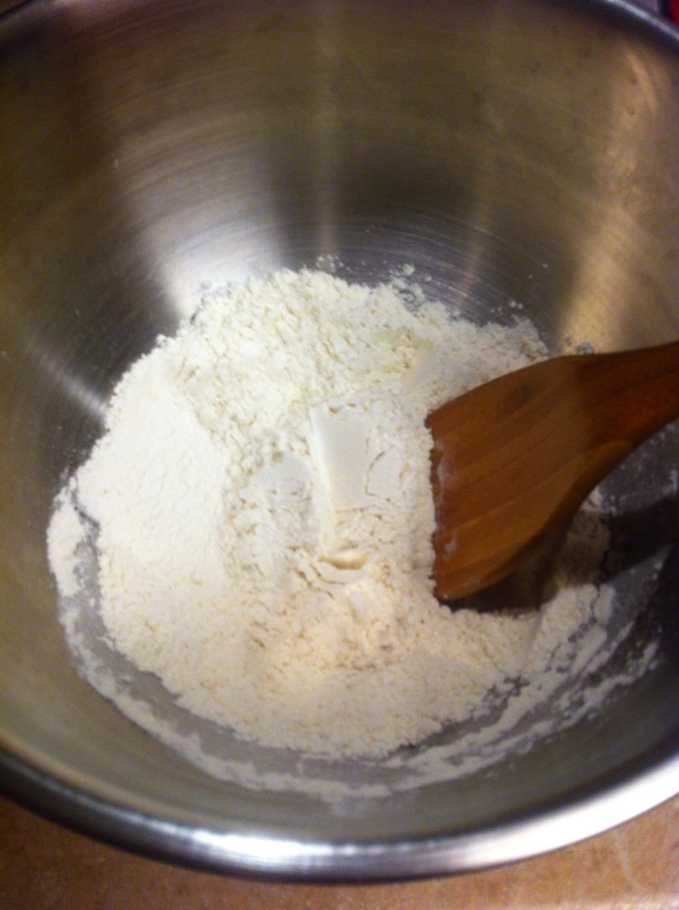 Combine 1 cup flour, 2 teaspoons baking powder, and a pinch of salt in a bowl.