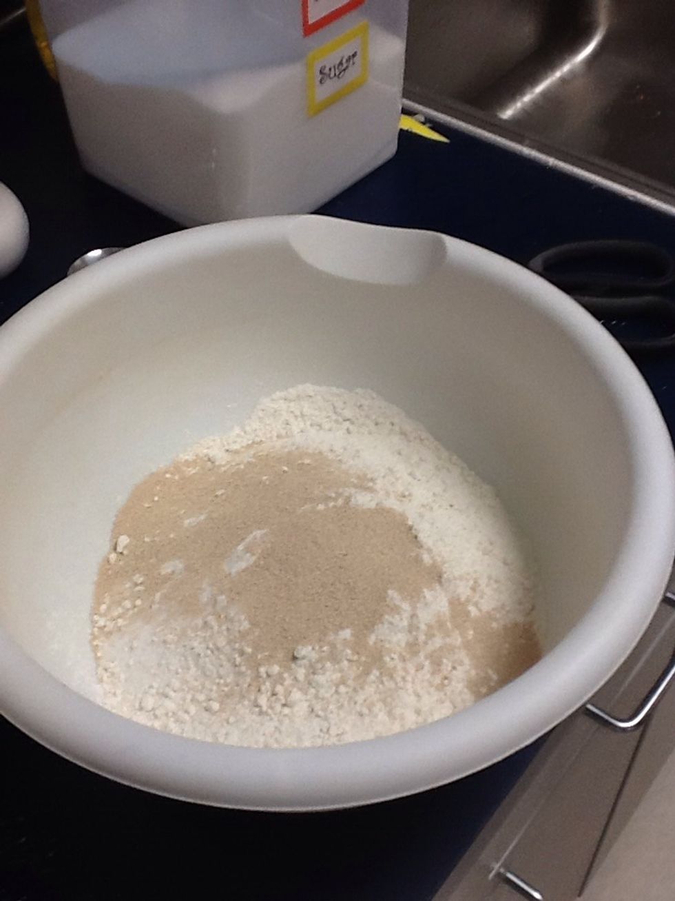 Combine 2 cups of flour,sugar and salt and yeast in a large mixing bowl (mix well).