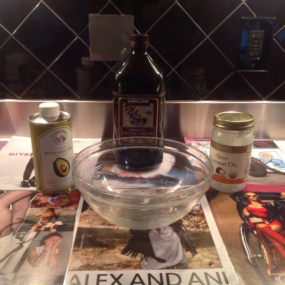 Combine all 3 oils (not including essential oils) into large glass bowl.