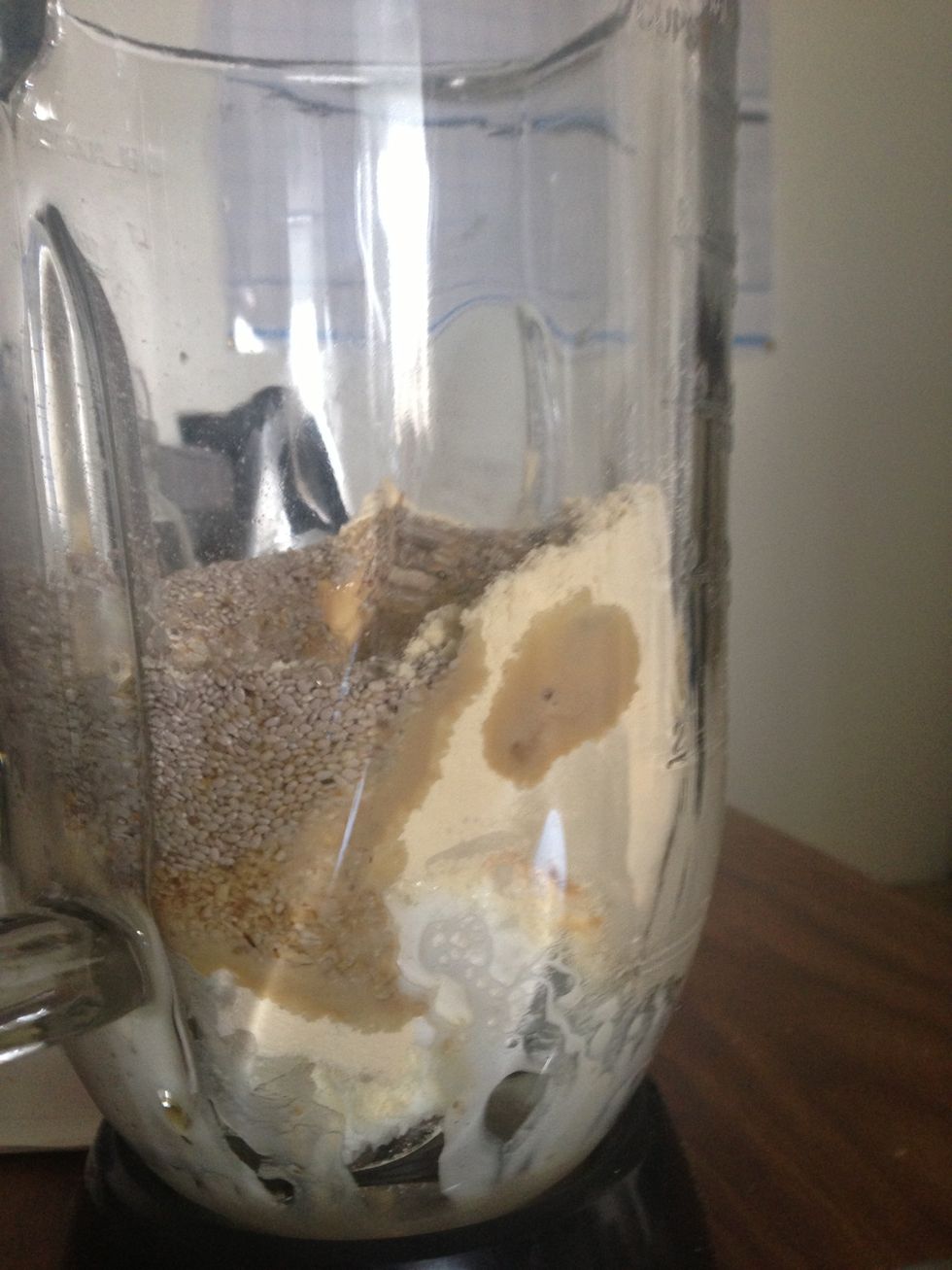 Combine all ingredients in a blender (i haven't added the almond milk yet, and i only add frozen blueberries for my boyfriend after I've poured my glass. The vanilla-coconut base is good on its own.)