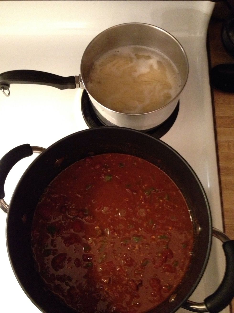 Combine all ingredients in a medium pot and Simmer for 20 mins. and serve with spaghetti on the side. Also consider serving with cheese, sour cream, diced onion, green onion as self serve toppings.