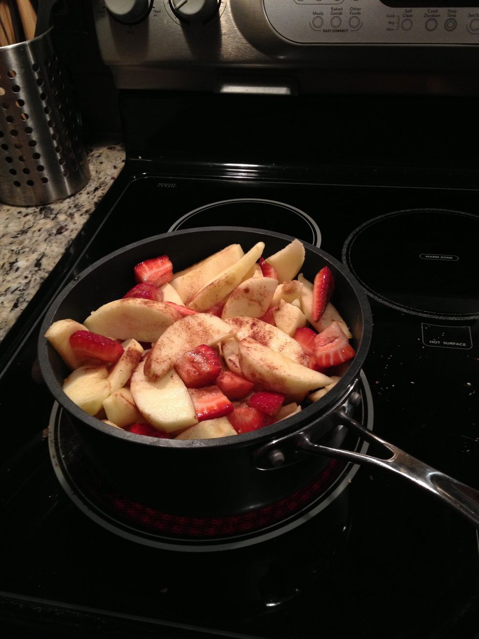 Combine all ingredients into a medium sauce pan (Water, apples, strawberries, and cinnamon) and cook at a medium high heat for 20 minutes. Stir occasionally. It will foam towards the end.