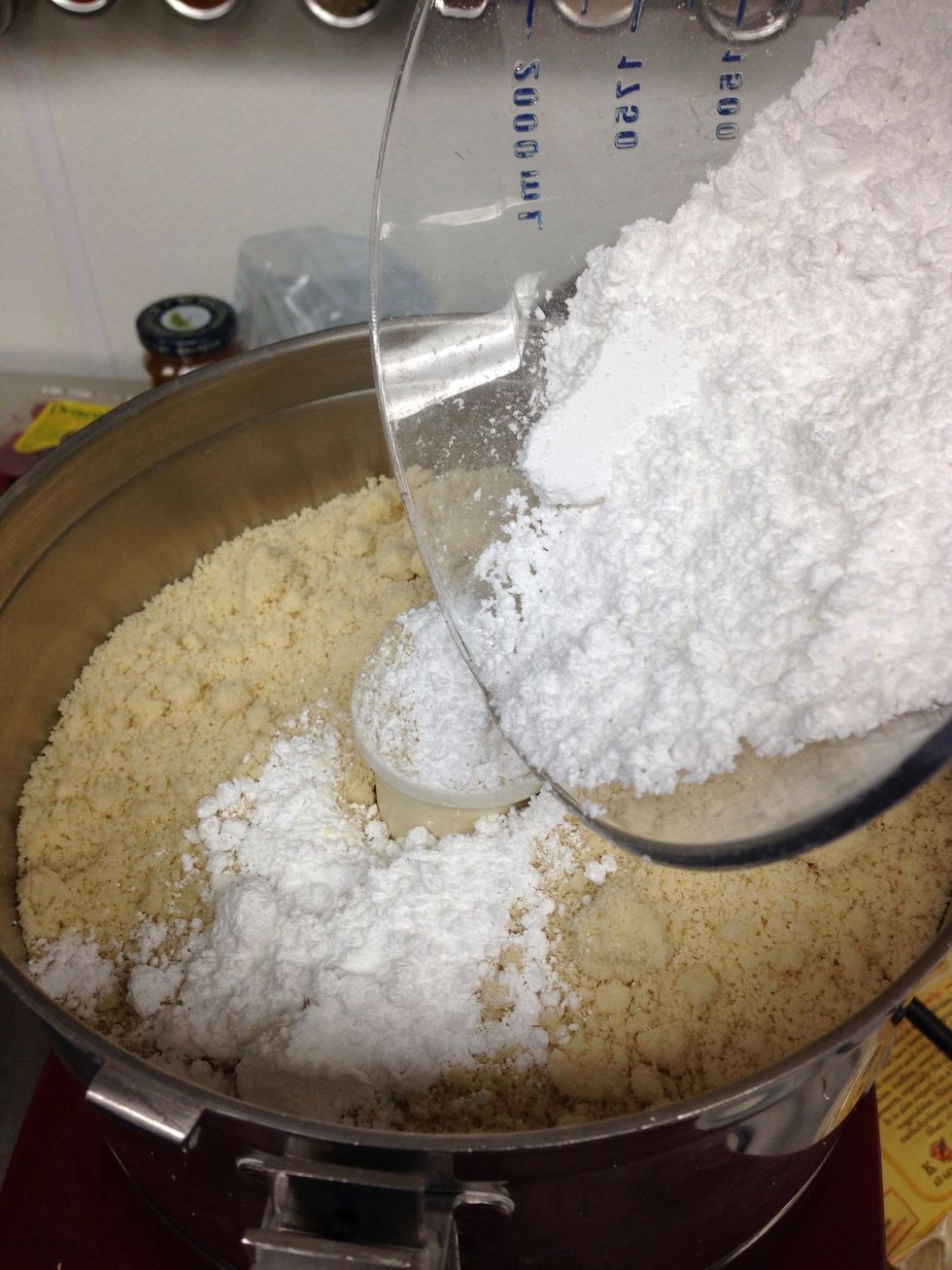 Combine almond flour and confectioners sugar in Robot Coup or food processor and pulse till fine and powdery. When finished place in large mixing bowl.