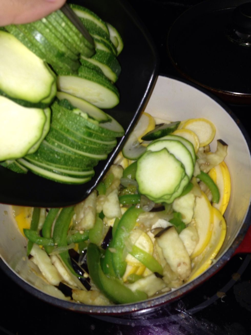 Combine as you go to let the garlic-onion-pepper mixture kind of cover the veggies. Then cover and let cook for about 10-15 mins.