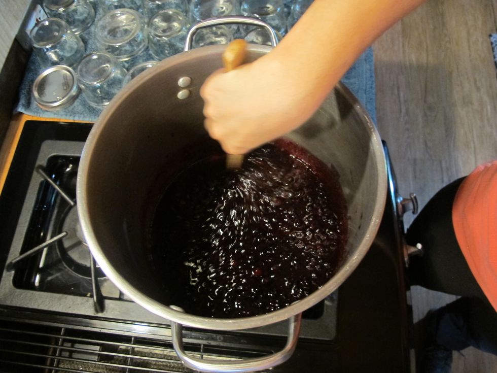 Combine berries, butter, and pectin then bring to a rolling boil. Add sugar and bring back to boil. Allow mixture to boil for exactly one minute.
