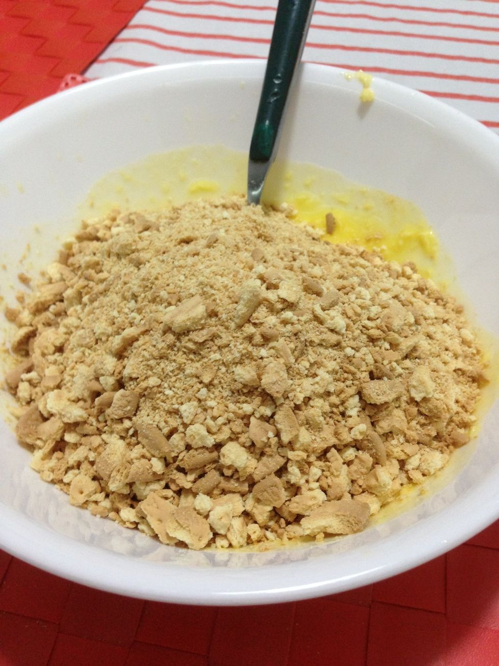 Combine biscuits with melted butter