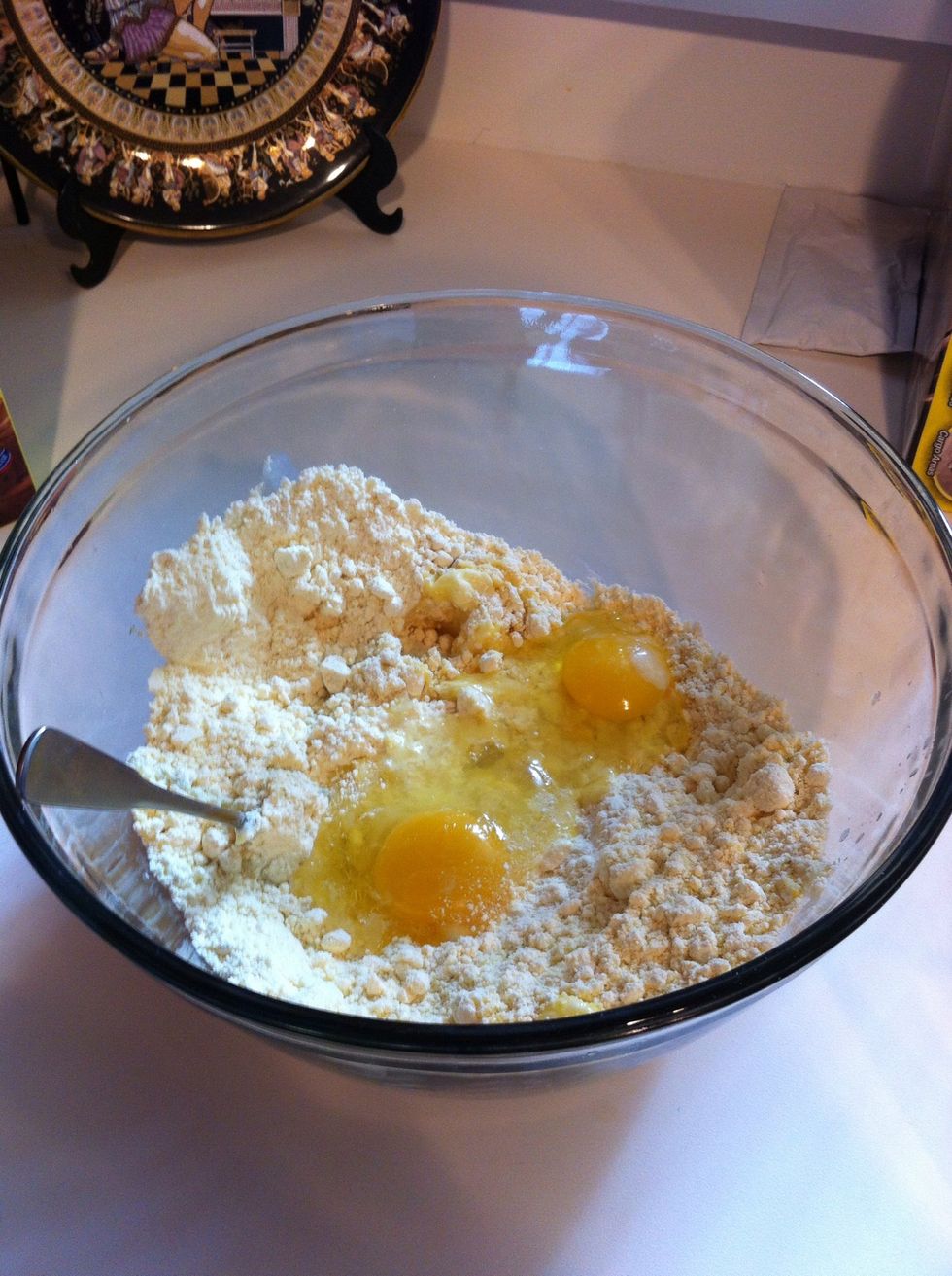 Combine box cake mix, 2 eggs and 6 tablespoons butter in bowl.