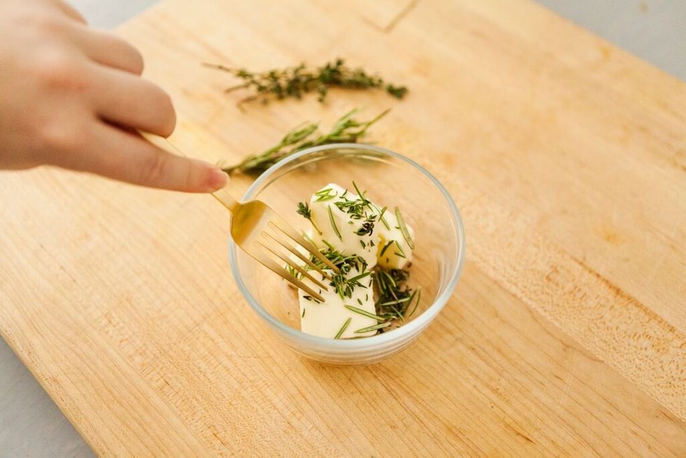Combine butter, thyme, rosemary and salt. Stir to combine and set aside.