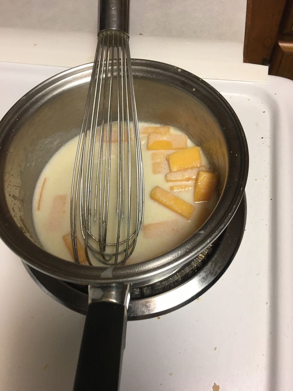 Combine cheese with the other mixture on stove