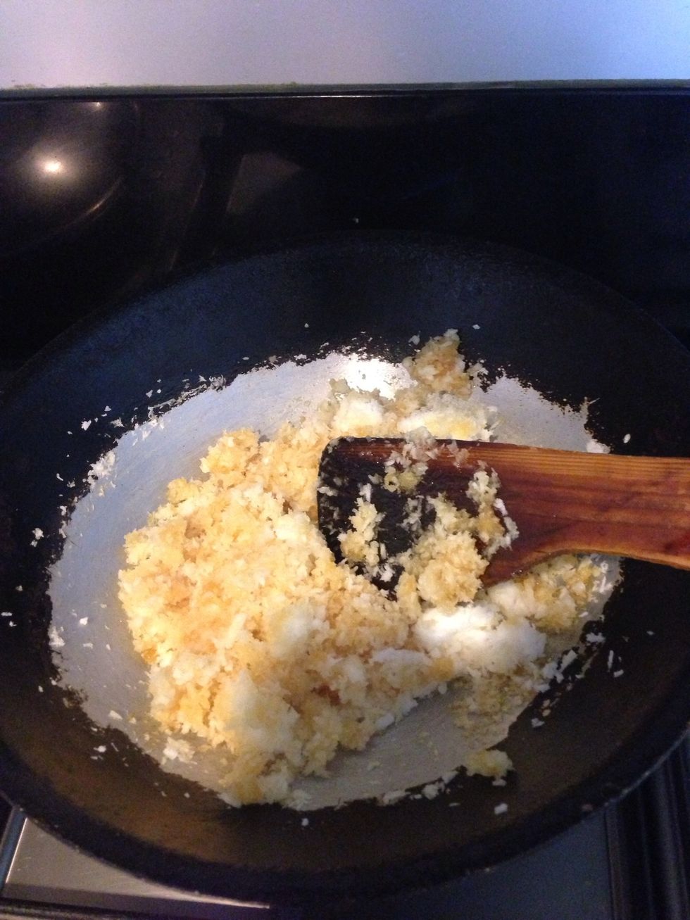 Combine coconut & jaggery and cook over a simmer for 10 mins. The jaggery should melt & combine with the coconut to make a sticky mixture. Put a pinch of cardamom at the end. The mixture is ready.