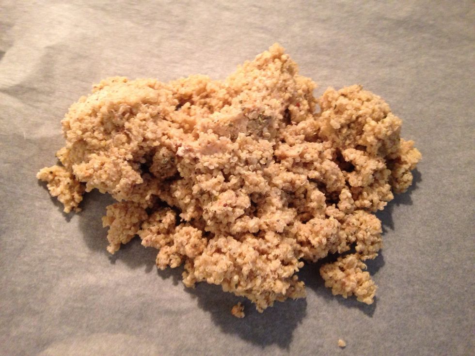 Combine cooked quinoa with flour mixture and 2 tbsps water and place it on a baking sheet. Don't forget to lay parchment paper underneath.