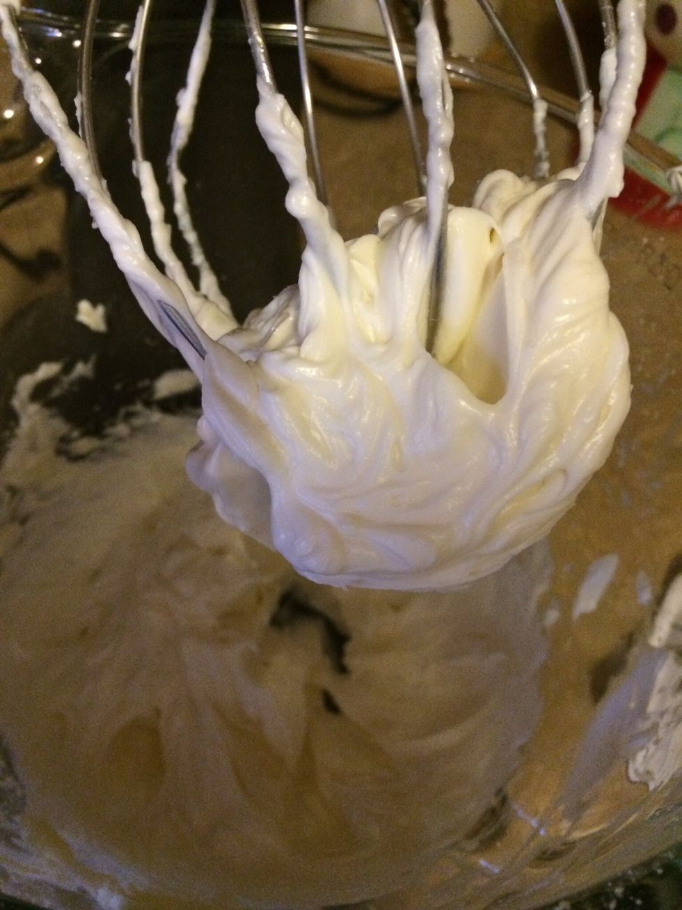 Combine cream cheese and butter mix until well blended - mix in vanilla extract and confectioners sugar 1/4 cup at a time - mix after each addition