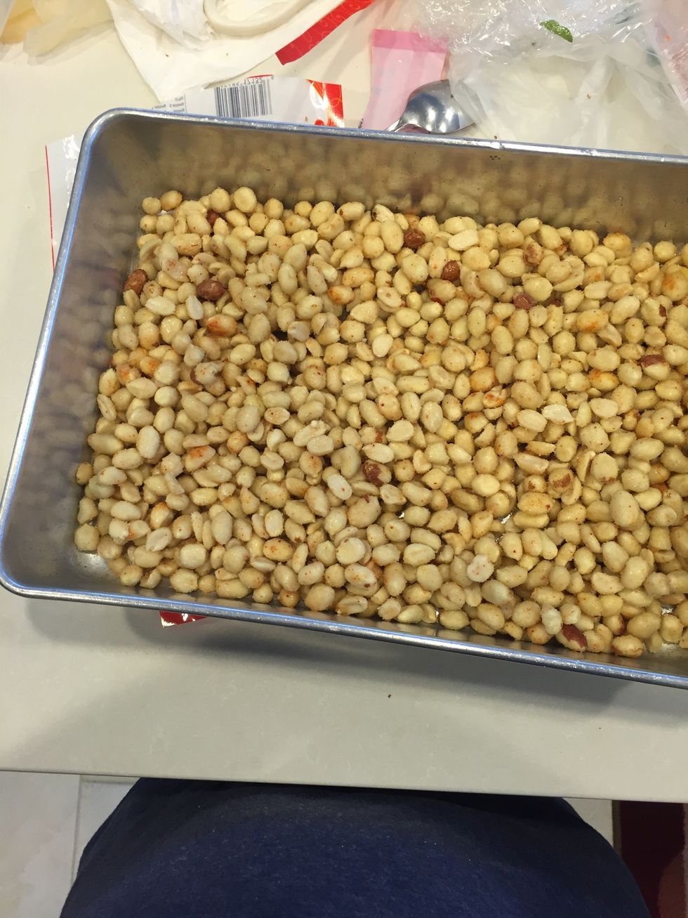 Combine dried ingredients in bag. Add peanuts, coat evenly. Spread on pan